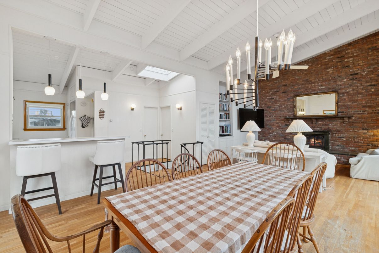 Dining room, Fireplace, Interior, Pendant Lights, Stone Walls, Wood Texture Flooring