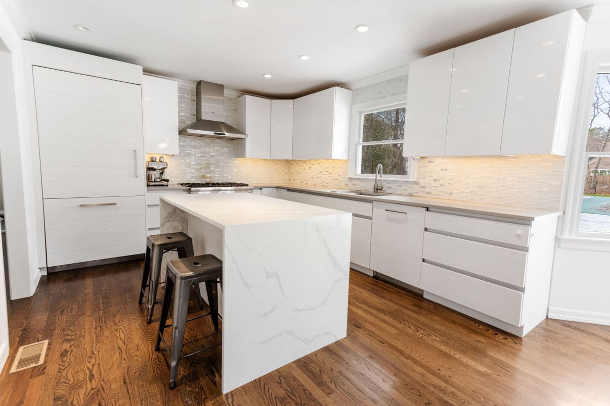 Interior, Kitchen, Marble Walls, Recessed Lighting, Stainless Steel Appliances, Wood Texture Flooring