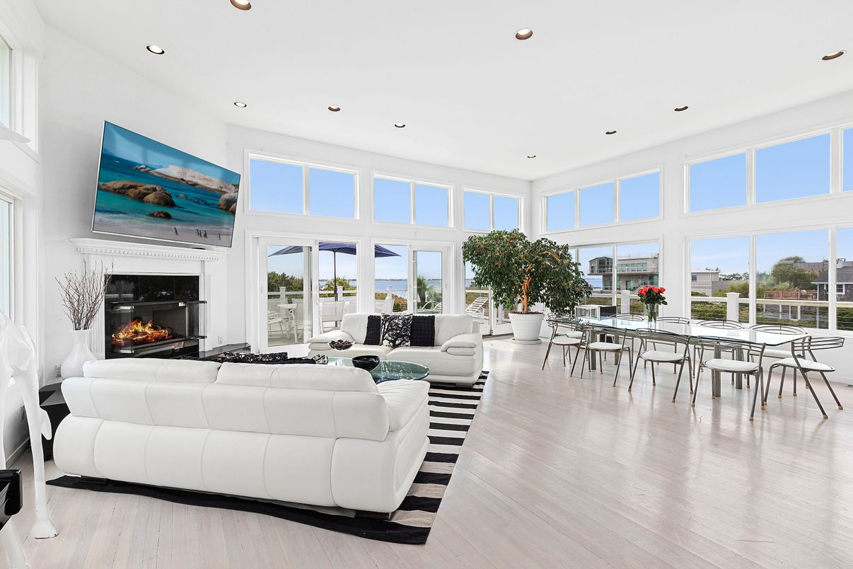 Dining room, Fireplace, Interior, Living room, Recessed Lighting, Wood Texture Flooring