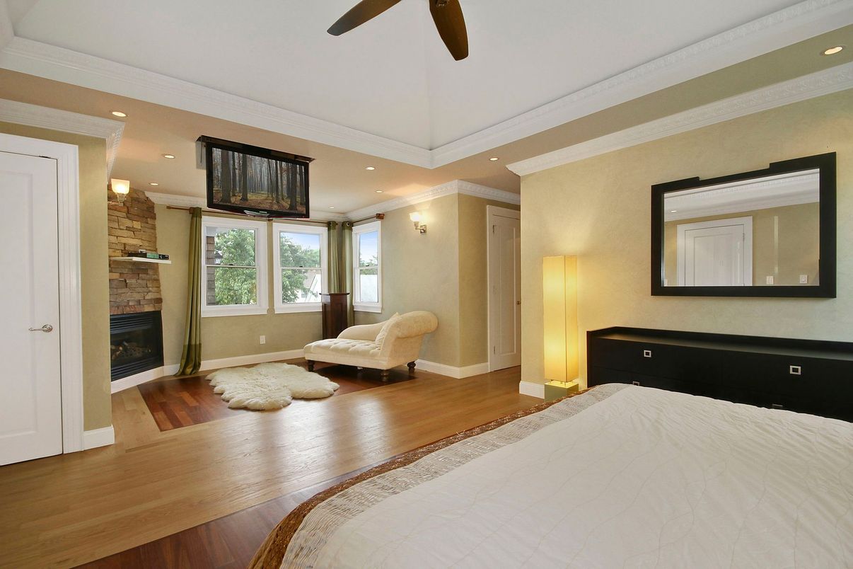 Bedroom, Fireplace, Interior, Recessed Lighting, Stone Walls, Wood Texture Flooring