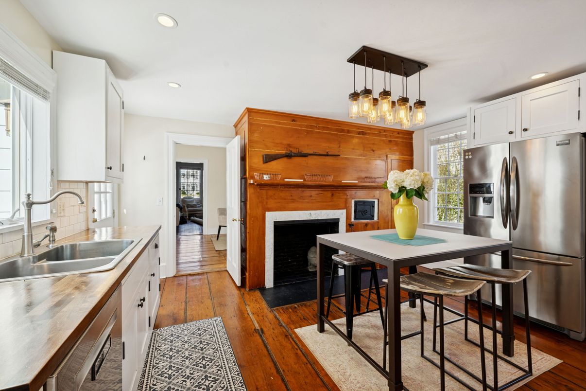 Dining room, Fireplace, Interior, Kitchen, Pendant Lights, Recessed Lighting, Stainless Steel Appliances, Wood Texture Flooring, Wooden Walls