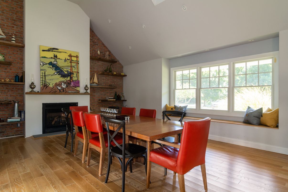 Dining room, Fireplace, Interior, Recessed Lighting, Stone Walls, Wood Texture Flooring