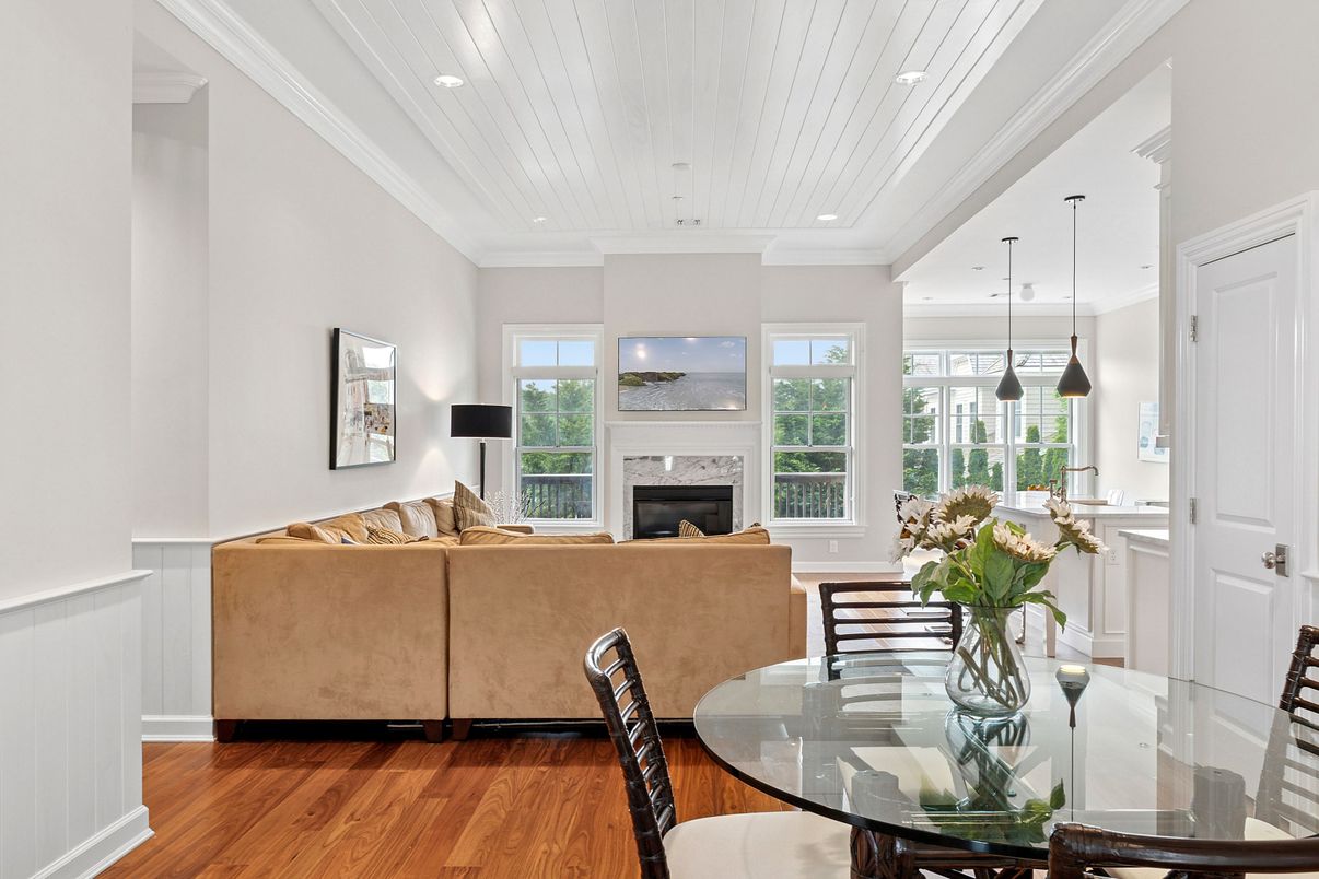Dining room, Fireplace, Interior, Living room, Pendant Lights, Recessed Lighting, Wood Texture Flooring