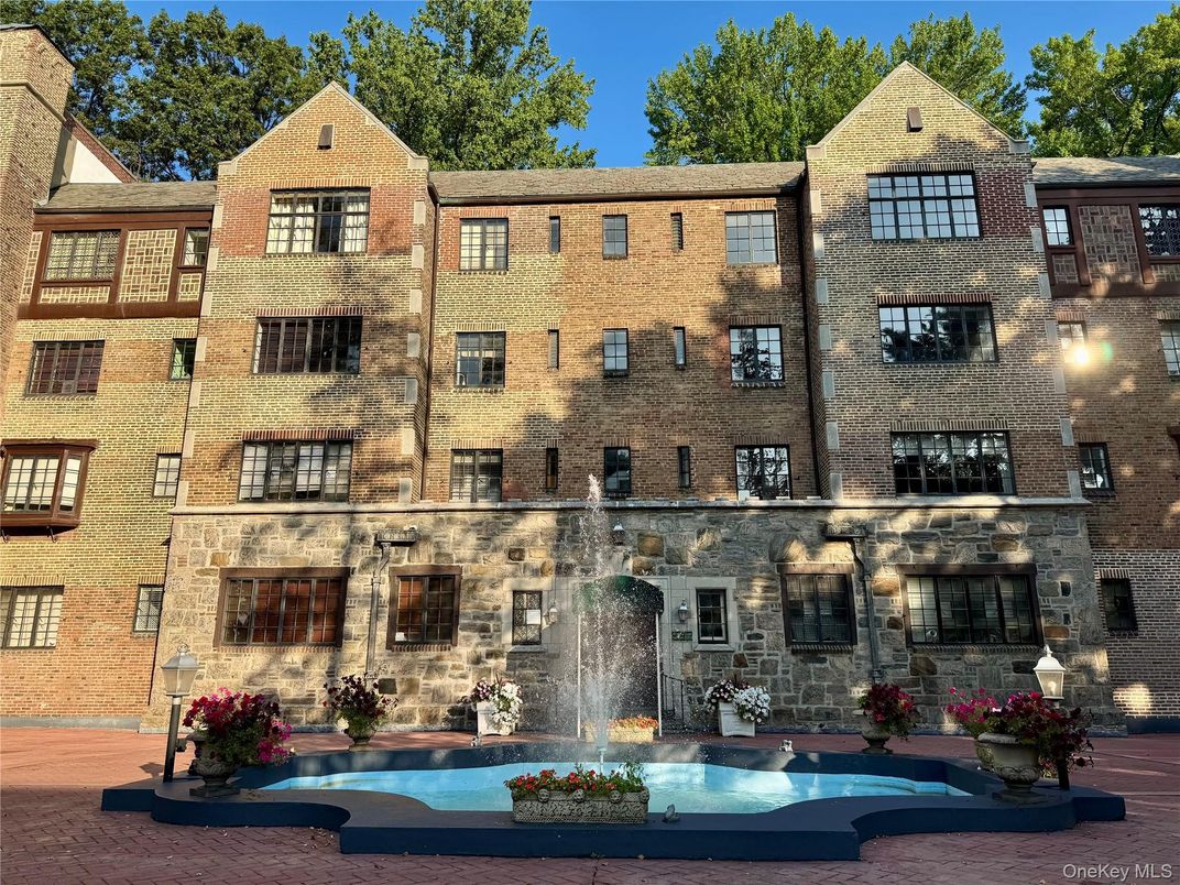 Exterior, Facade, Brick Facade, Pool, Condo Building