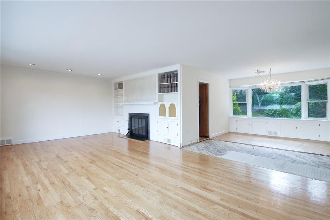 Chandelier, Empty room, Fireplace, Interior, Recessed Lighting, Wood Texture Flooring