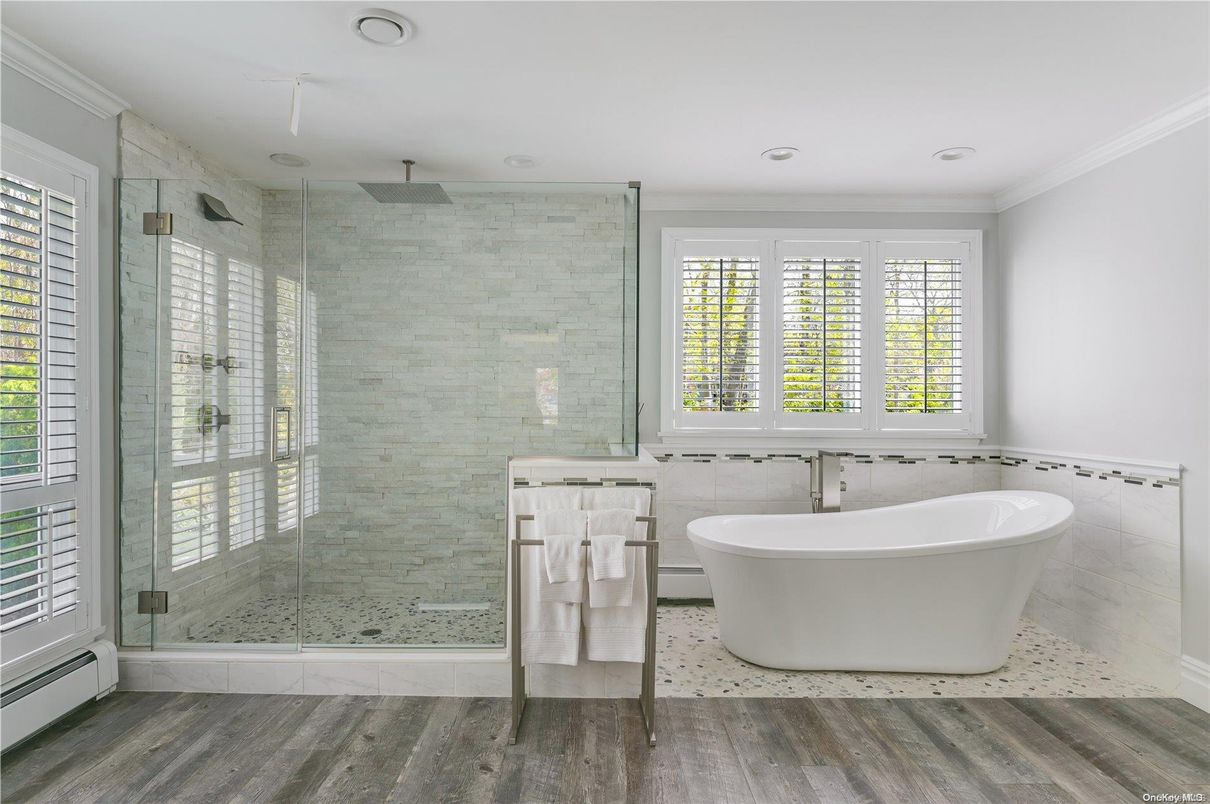 Bathroom, Free Standing Baths, Glass Shower, Interior, Recessed Lighting, Wood Texture Flooring