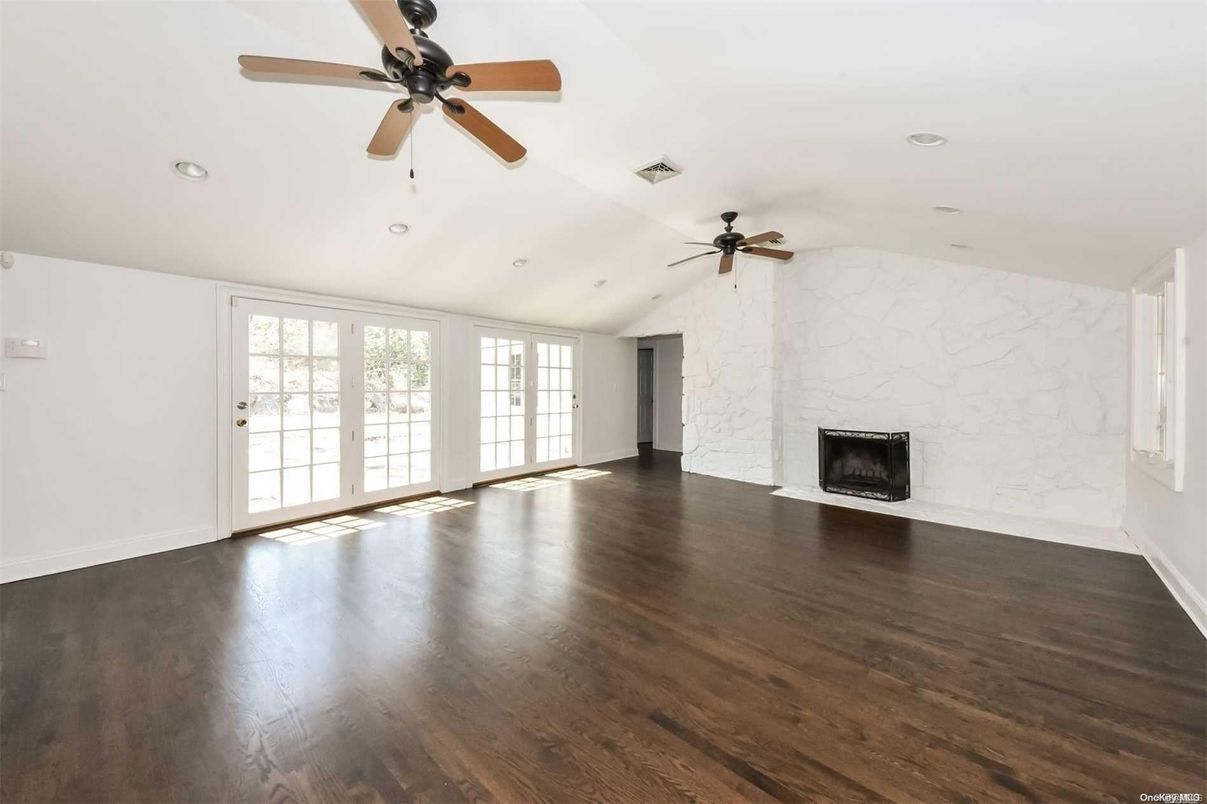 Empty room, Fireplace, Interior, Marble Walls, Recessed Lighting, Wood Texture Flooring