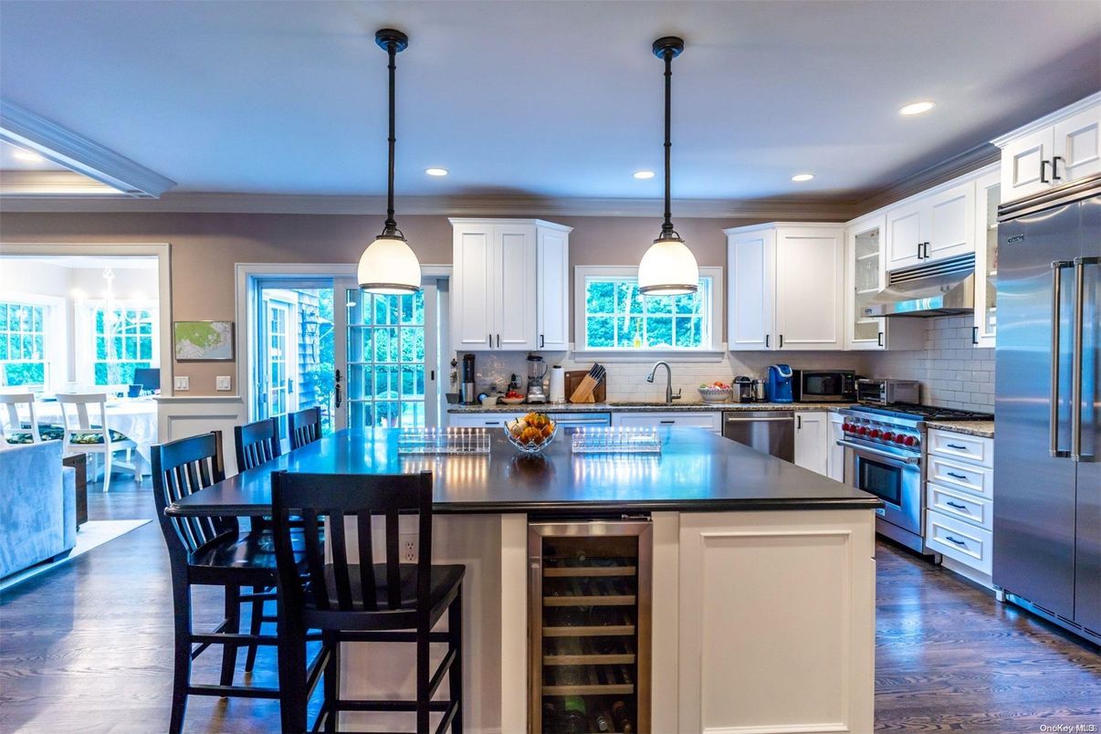 Dining room, Interior, Kitchen, Pendant Lights, Recessed Lighting, Stainless Steel Appliances, Wood Texture Flooring