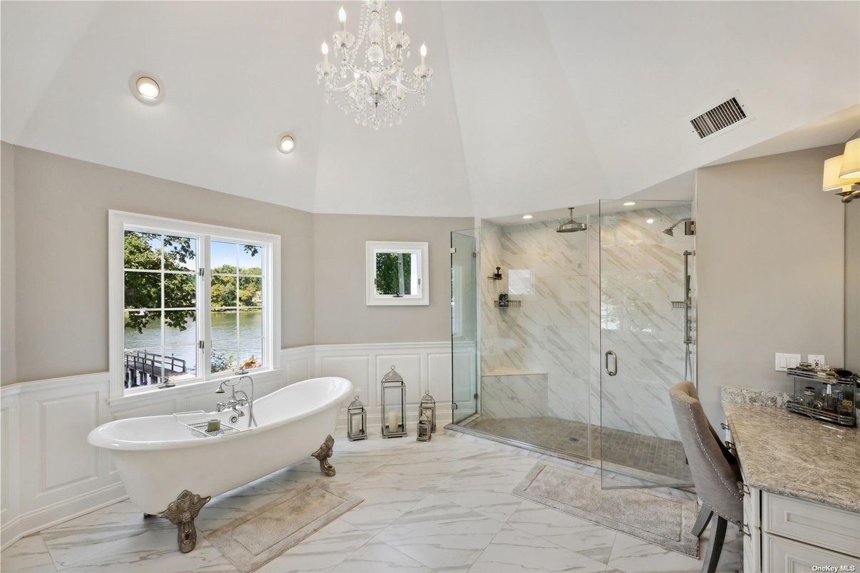 Bathroom, Chandelier, Free Standing Baths, Glass Shower, Interior, Marble, Marble Walls, Recessed Lighting, Water