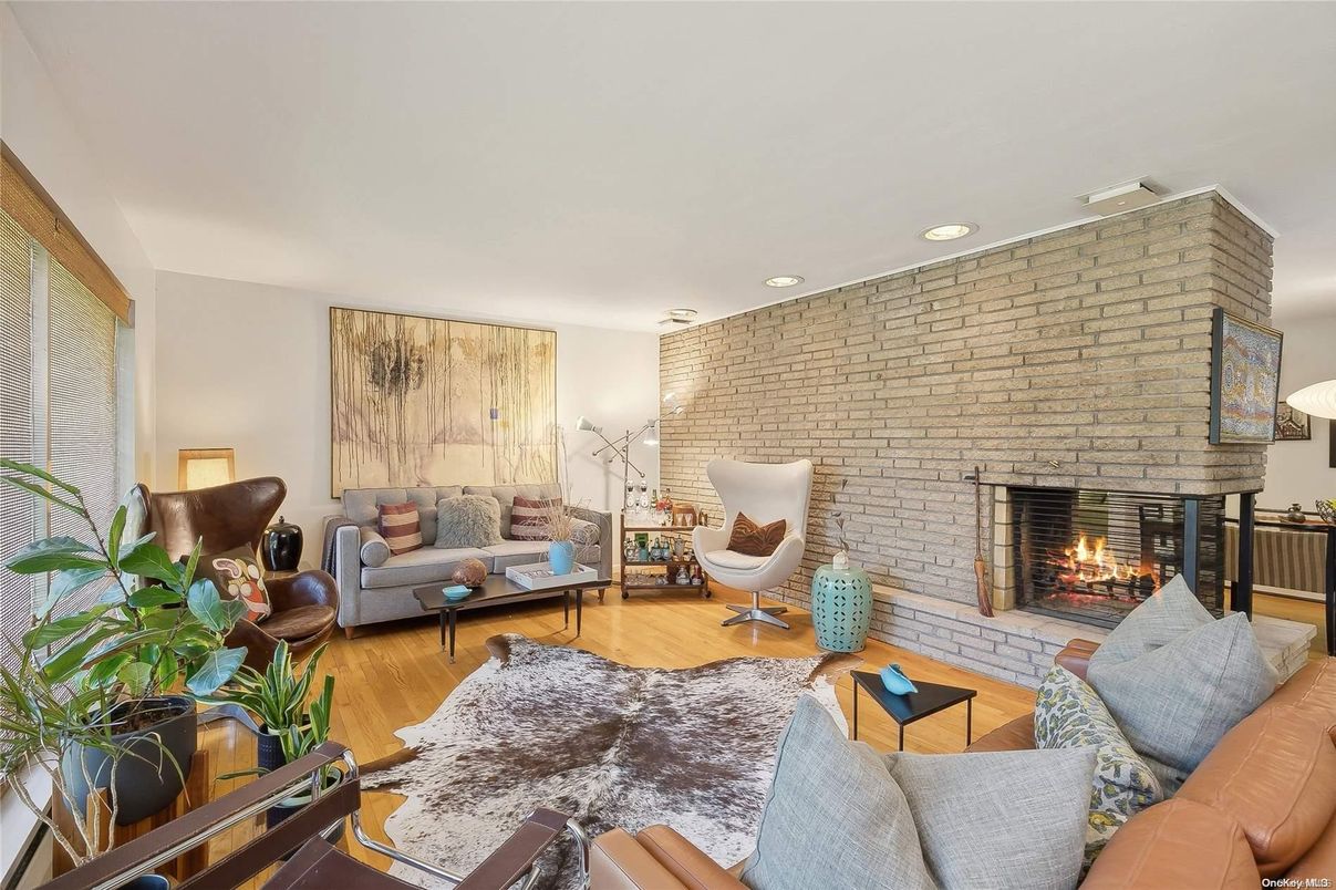 Fireplace, Interior, Living room, Recessed Lighting, Stone Walls, Wood Texture Flooring
