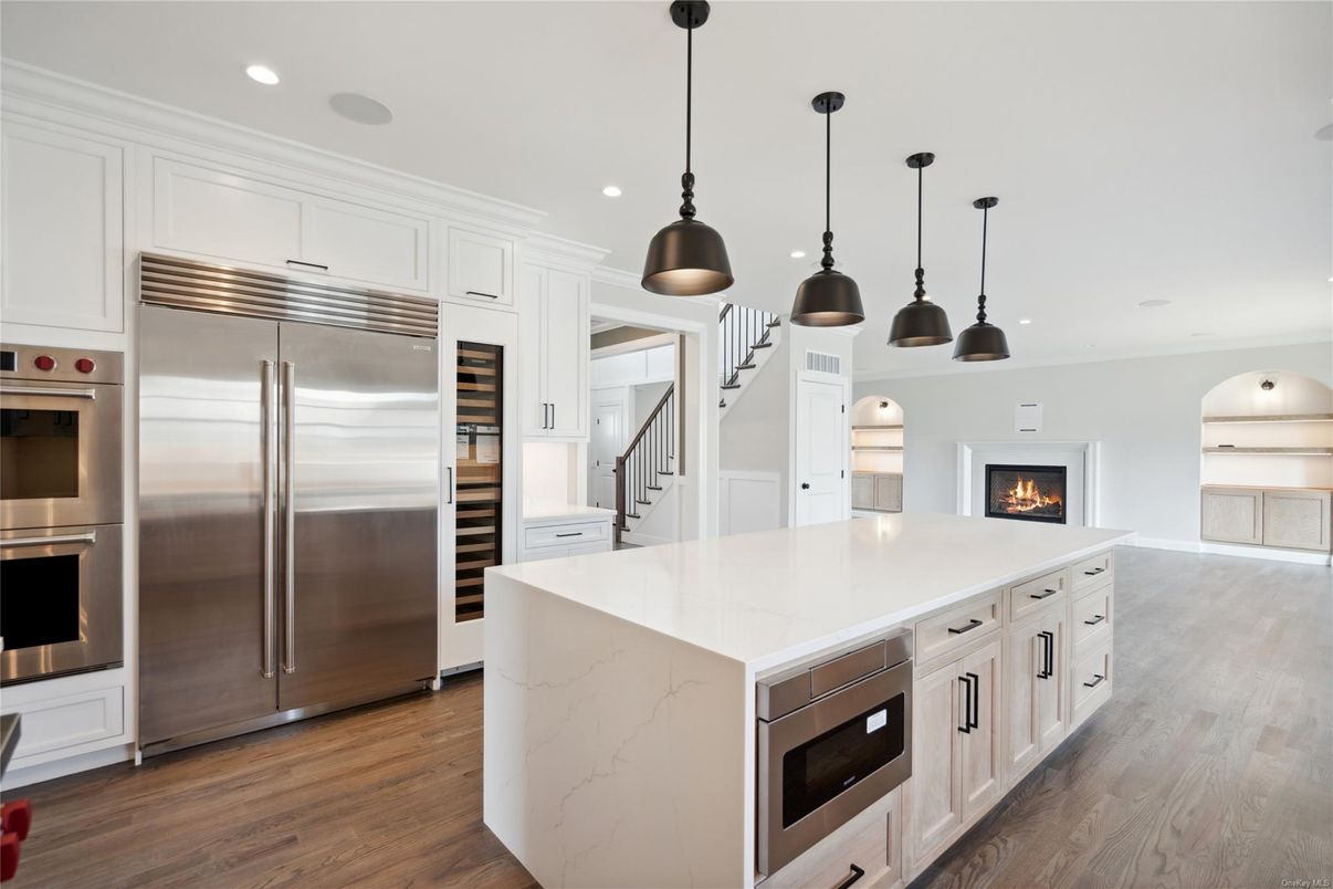 Fireplace, Interior, Kitchen, Pendant Lights, Recessed Lighting, Stainless Steel Appliances, Wood Texture Flooring