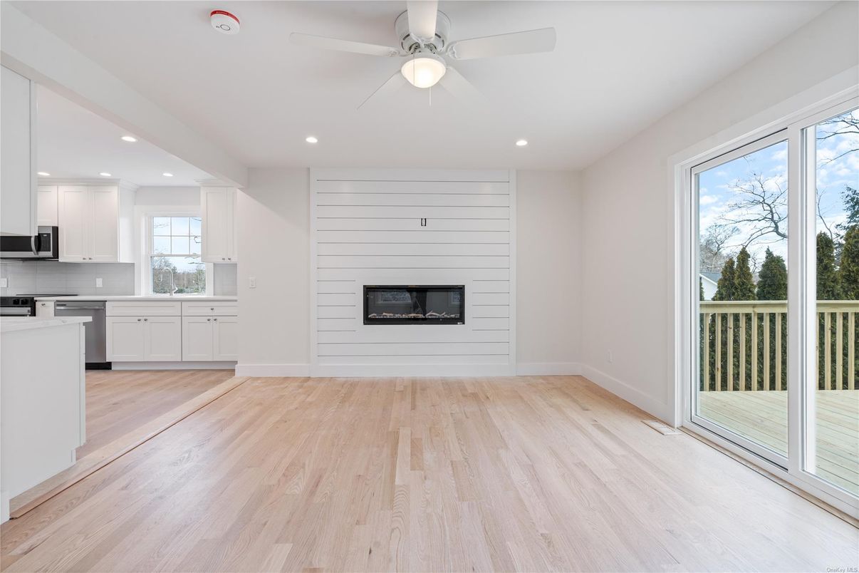Empty room, Fireplace, Interior, Kitchen, Recessed Lighting, Wood Texture Flooring