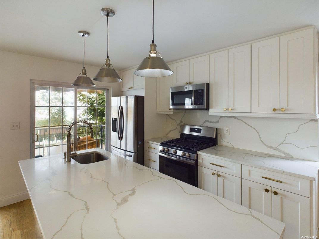 Interior, Kitchen, Marble Walls, Pendant Lights, Stainless Steel Appliances, Wood Texture Flooring