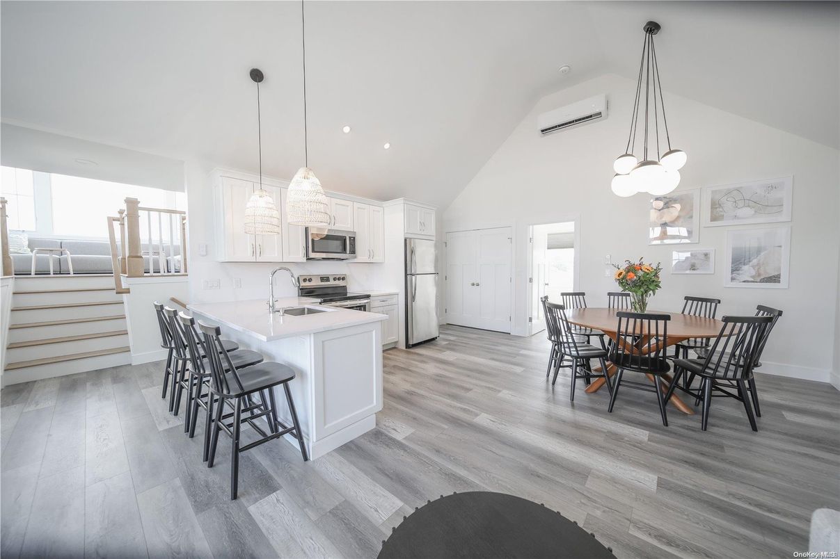 Dining room, Interior, Kitchen, Pendant Lights, Recessed Lighting, Stainless Steel Appliances, Wood Texture Flooring