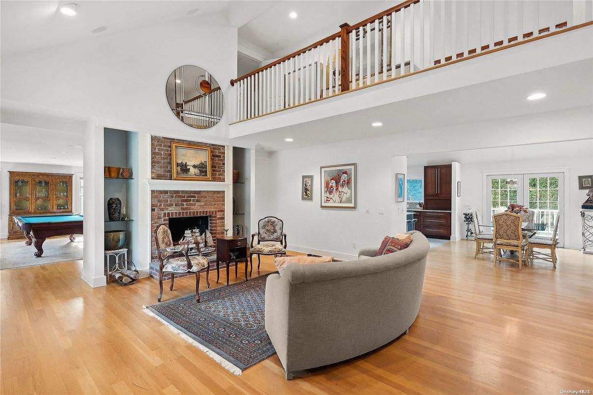 Billiard Table, Dining room, Fireplace, Game Room, Interior, Living room, Recessed Lighting, Wood Texture Flooring
