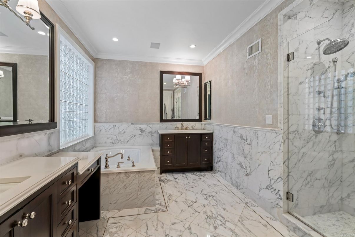 Bathroom, Dual Sink Vanities, Glass Shower, Interior, Marble, Marble Walls, Recessed Lighting