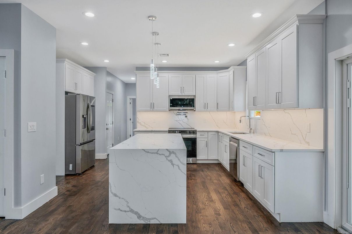 Interior, Kitchen, Marble Walls, Pendant Lights, Recessed Lighting, Stainless Steel Appliances, Wood Texture Flooring