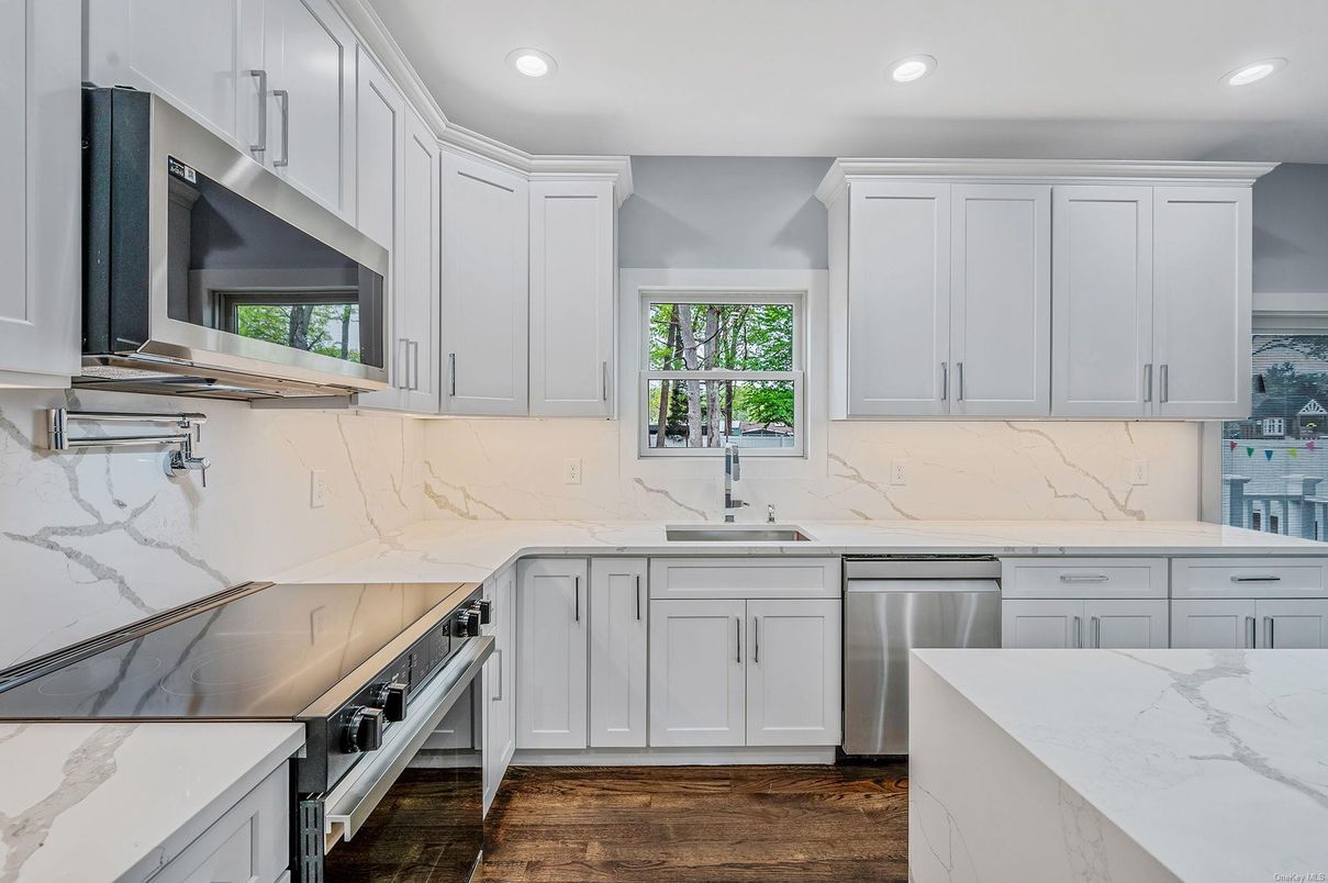 Interior, Kitchen, Marble Walls, Recessed Lighting, Stainless Steel Appliances, Wood Texture Flooring
