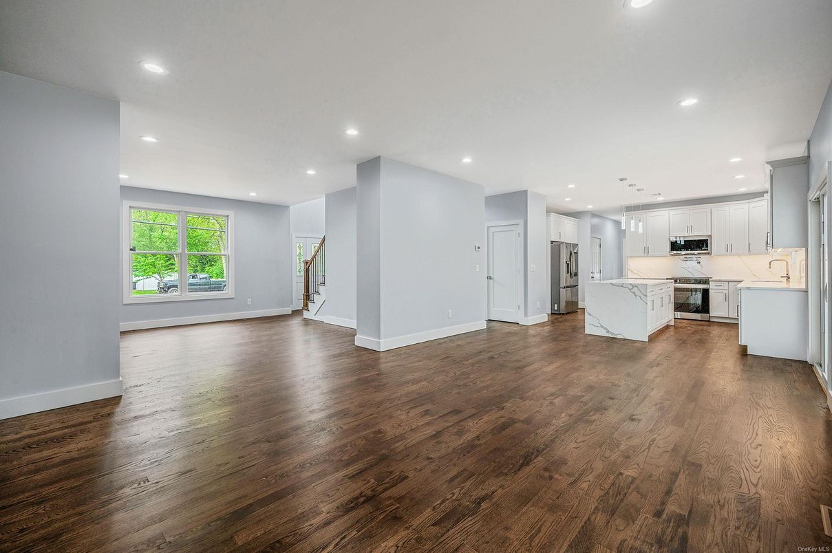 Interior, Kitchen, Marble Walls, Recessed Lighting, Stainless Steel Appliances, Wood Texture Flooring