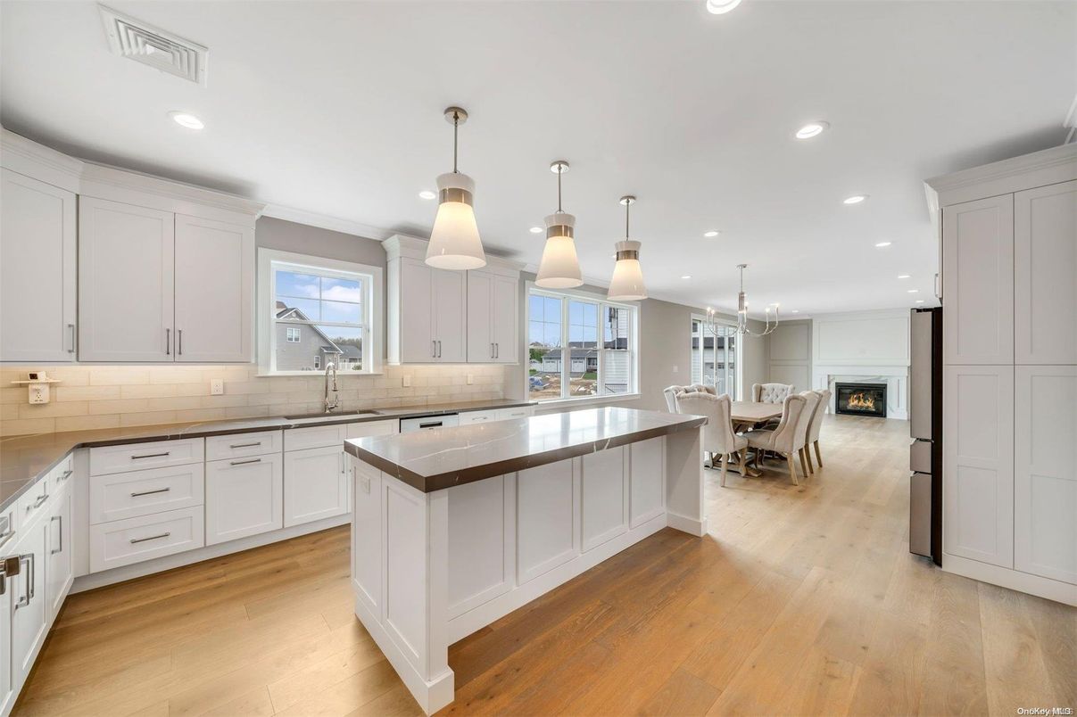 Dining room, Fireplace, Interior, Kitchen, Pendant Lights, Recessed Lighting, Wood Texture Flooring