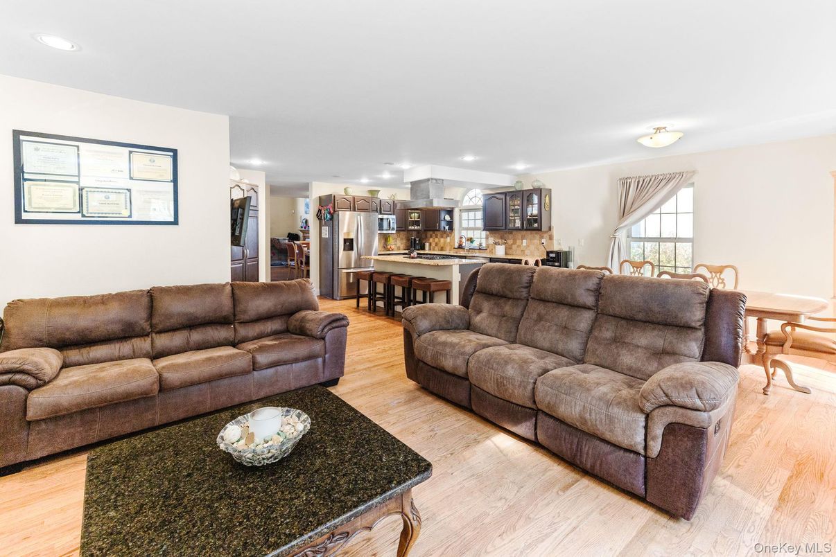 Dining room, Interior, Kitchen, Living room, Recessed Lighting, Stainless Steel Appliances, Wood Texture Flooring