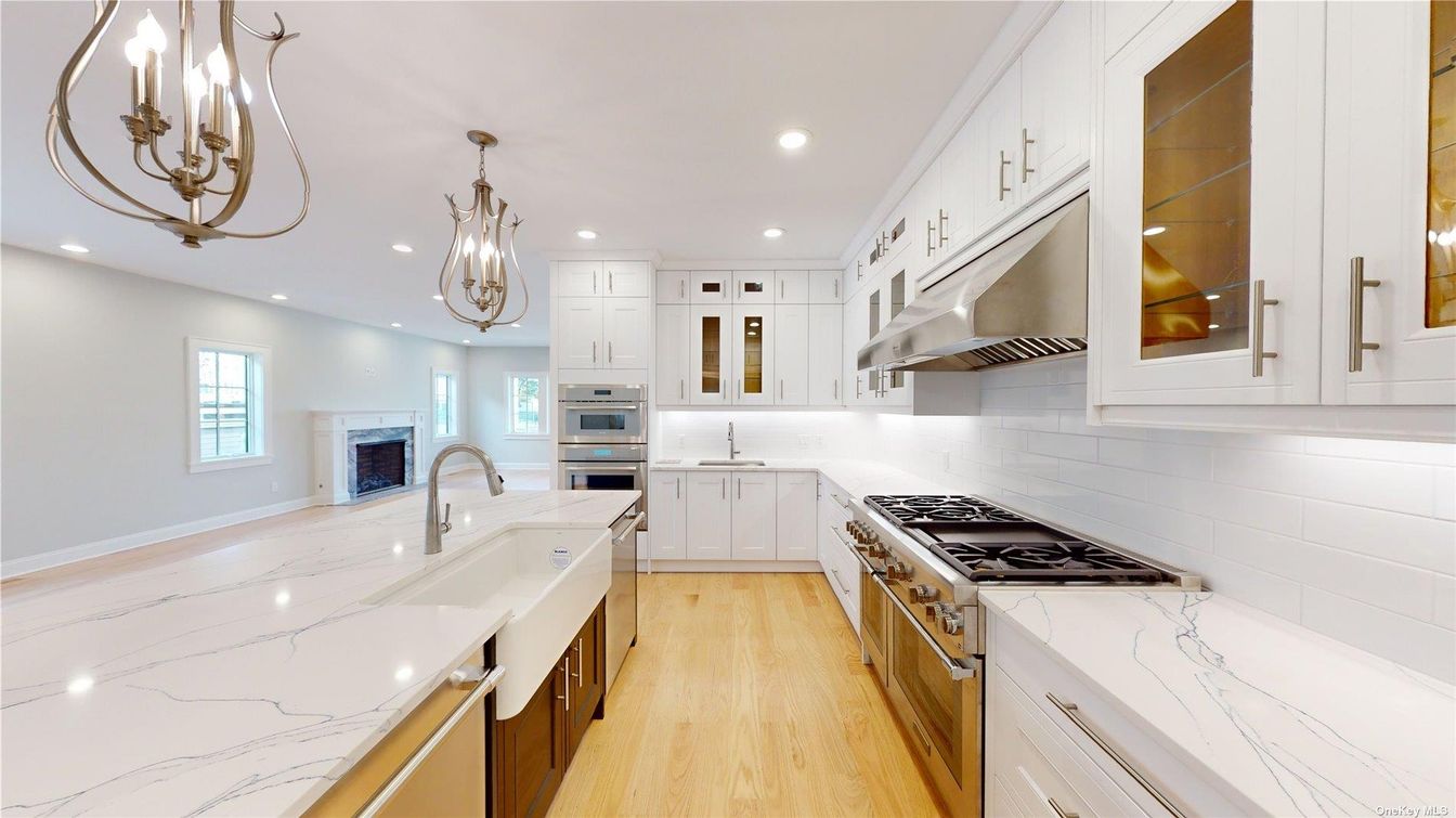 Chandelier, Fireplace, Interior, Kitchen, Pendant Lights, Recessed Lighting, Stainless Steel Appliances, Wood Texture Flooring