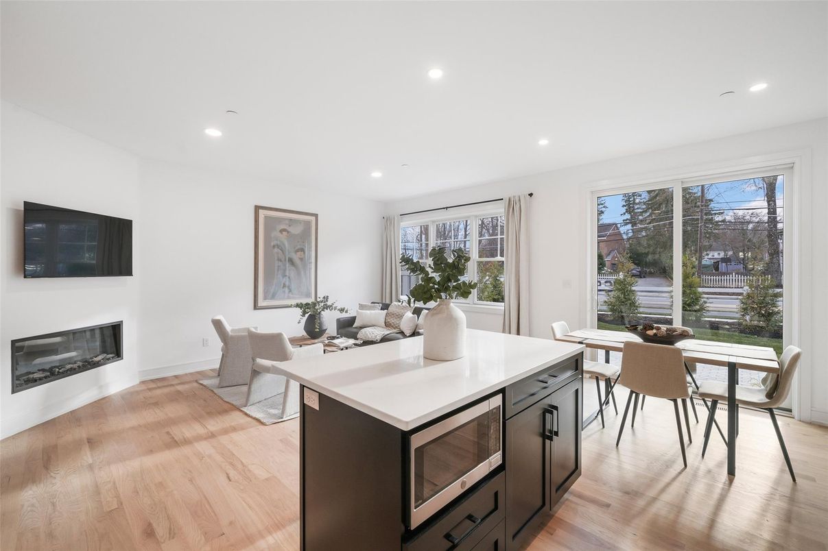 Dining room, Fireplace, Interior, Kitchen, Recessed Lighting, Wood Texture Flooring