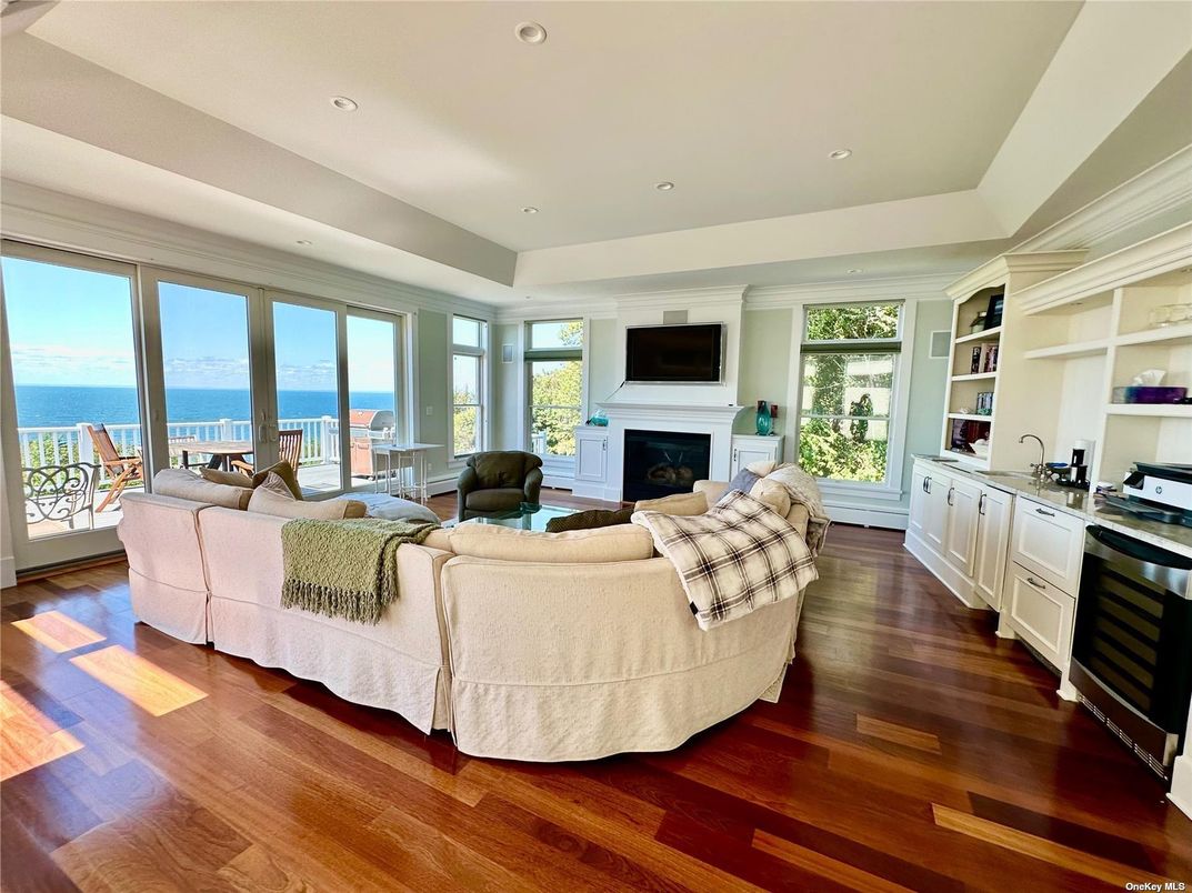 Fireplace, Interior, Living room, Recessed Lighting, Water, Wood Texture Flooring