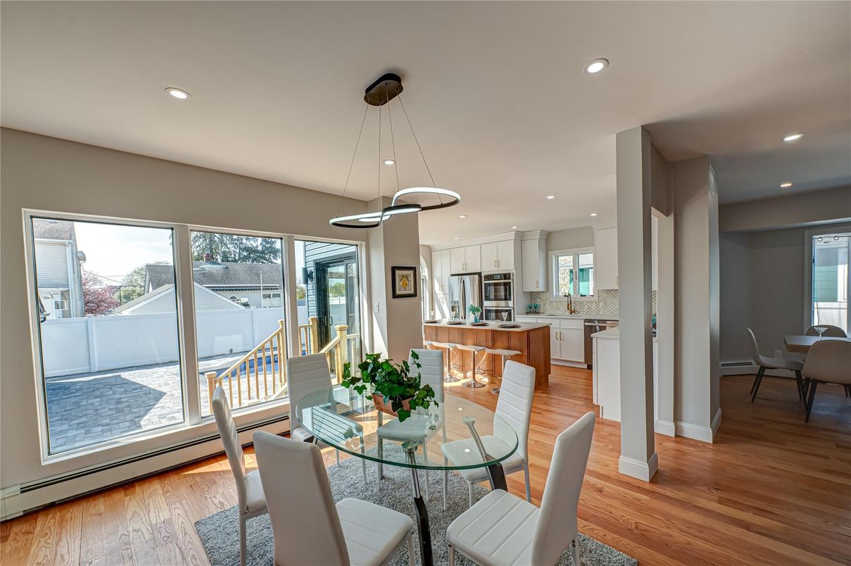 Dining room, Interior, Kitchen, Pendant Lights, Recessed Lighting, Stainless Steel Appliances, Wood Texture Flooring