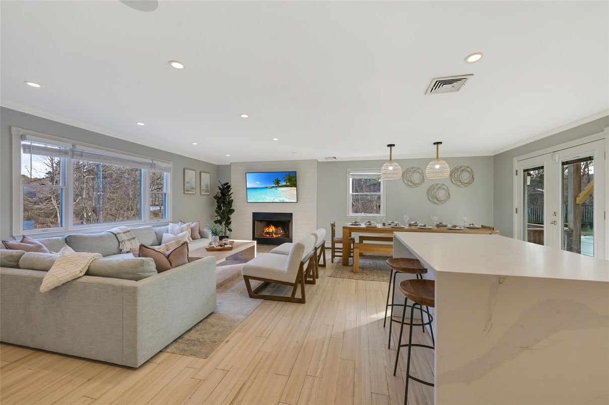 Dining room, Fireplace, Interior, Living room, Pendant Lights, Recessed Lighting, Wood Texture Flooring