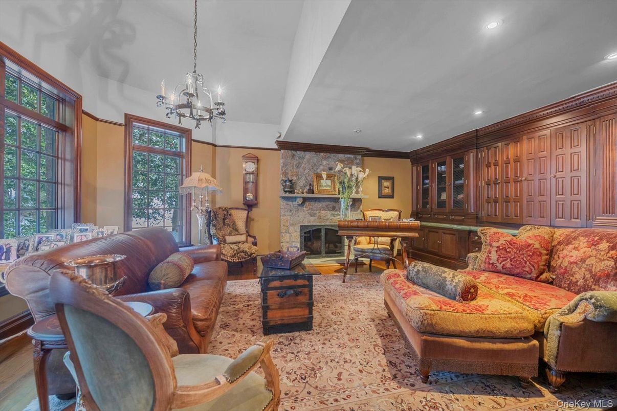 Chandelier, Fireplace, Interior, Living room, Pendant Lights, Piano, Recessed Lighting, Stone Walls