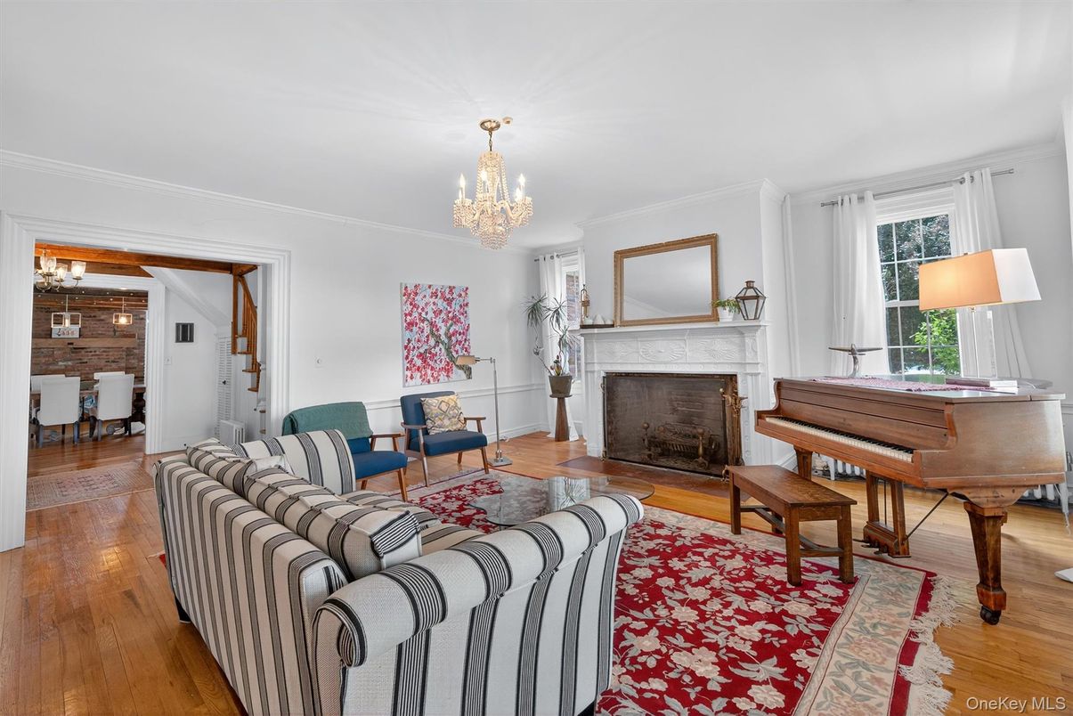 Chandelier, Fireplace, Interior, Living room, Piano, Wood Texture Flooring