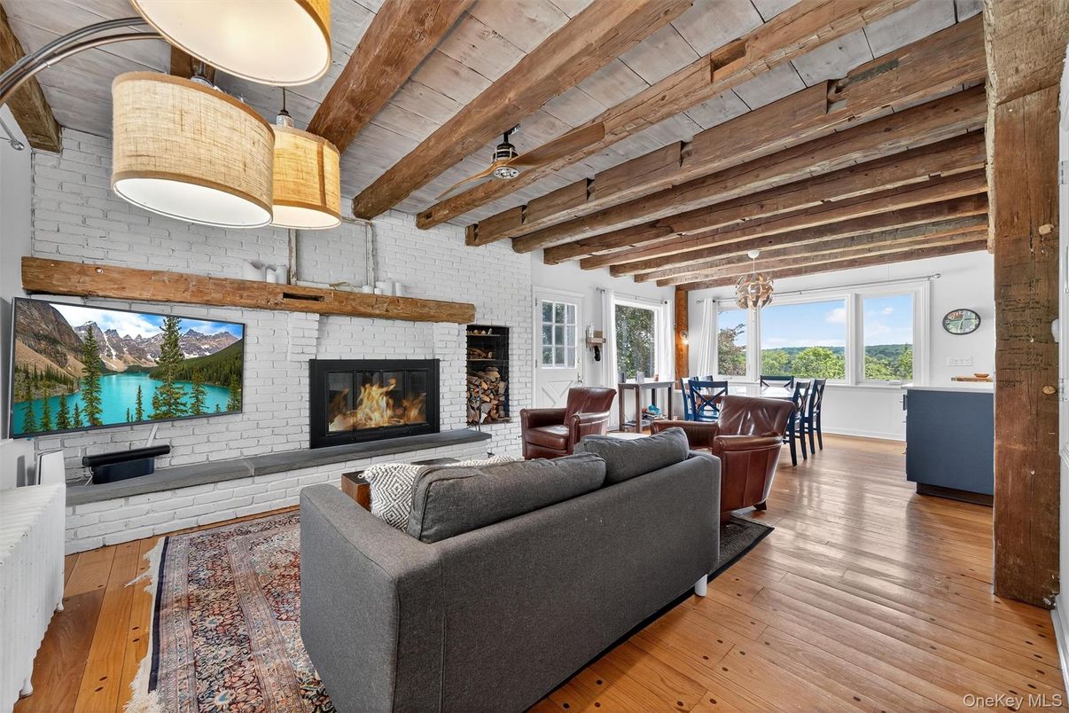 Dining room, Fireplace, Interior, Living room, Pendant Lights, Stone Walls, Wooden Beams, Wooden Ceilings, Wood Texture Flooring