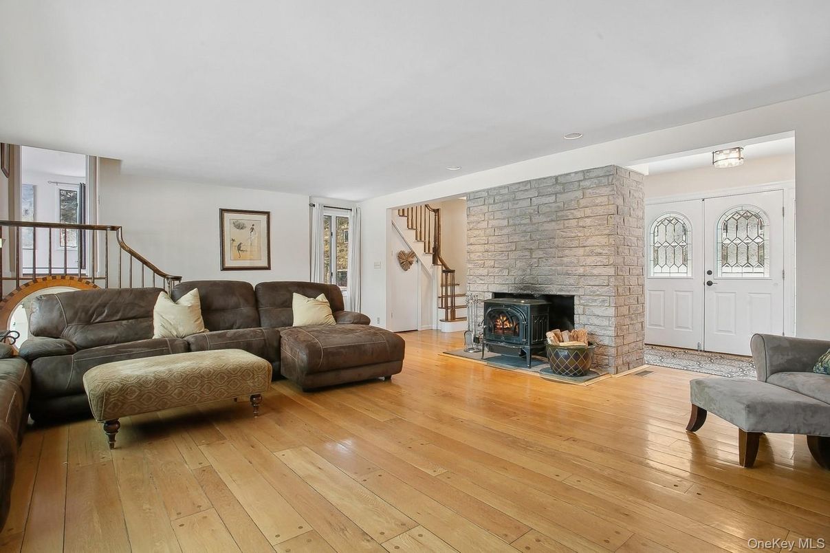 Fireplace, Interior, Living room, Recessed Lighting, Stone Walls, Wood Texture Flooring