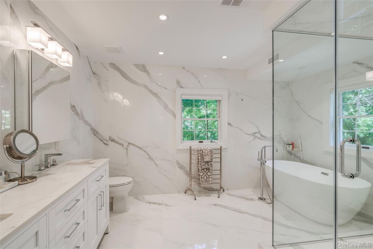 Bathroom, Dual Sink Vanities, Glass Shower, Interior, Marble, Marble Walls, Recessed Lighting
