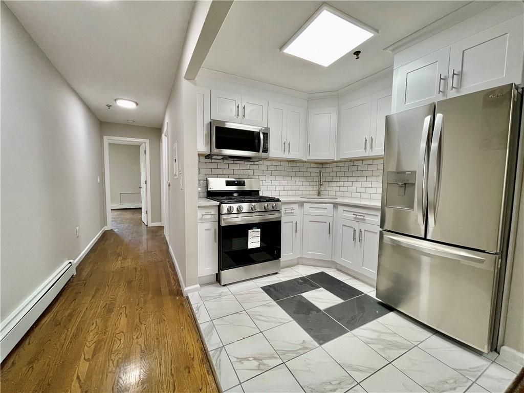 Interior, Kitchen, Marble, Recessed Lighting, Stainless Steel Appliances, Wood Texture Flooring