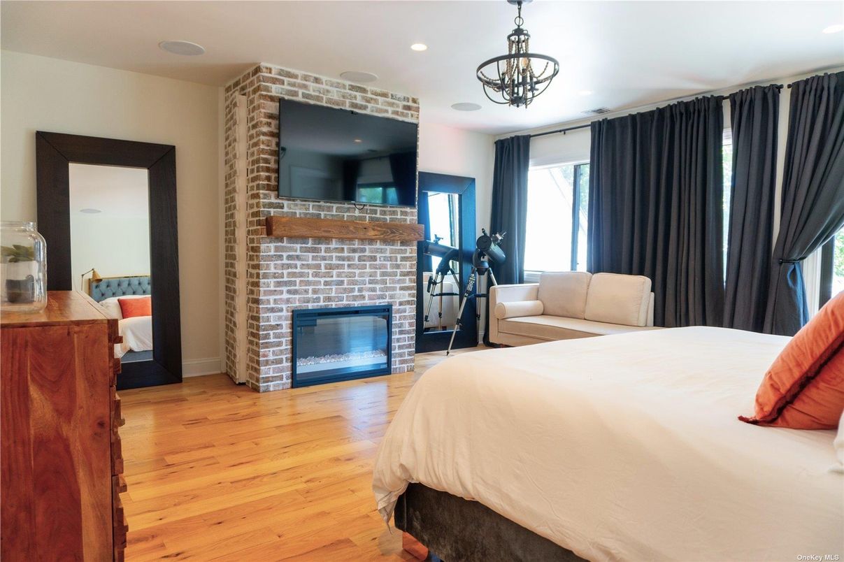Bedroom, Fireplace, Interior, Recessed Lighting, Wood Texture Flooring