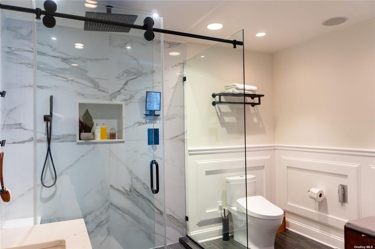 Bathroom, Glass Shower, Interior, Marble Walls, Recessed Lighting, Wood Texture Flooring