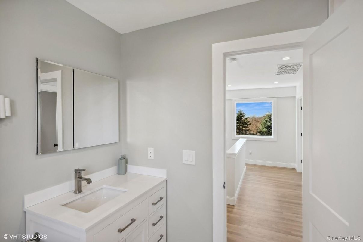 Bathroom, Dual Sink Vanities, Interior, Recessed Lighting, Wood Texture Flooring