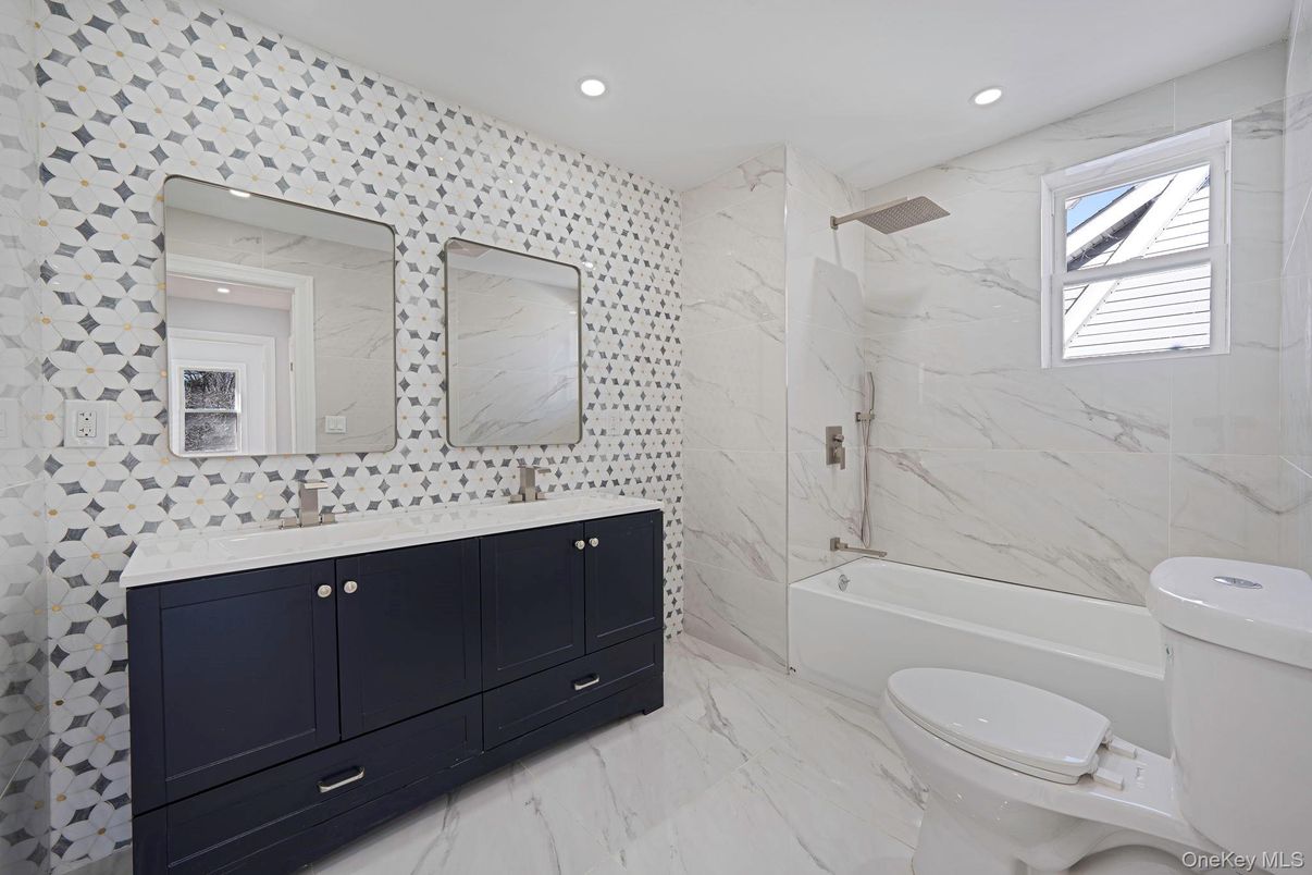 Bathroom, Dual Sink Vanities, Interior, Marble, Marble Walls, Recessed Lighting
