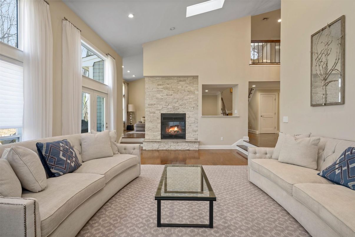Fireplace, Interior, Living room, Recessed Lighting, Stone Walls, Wood Texture Flooring