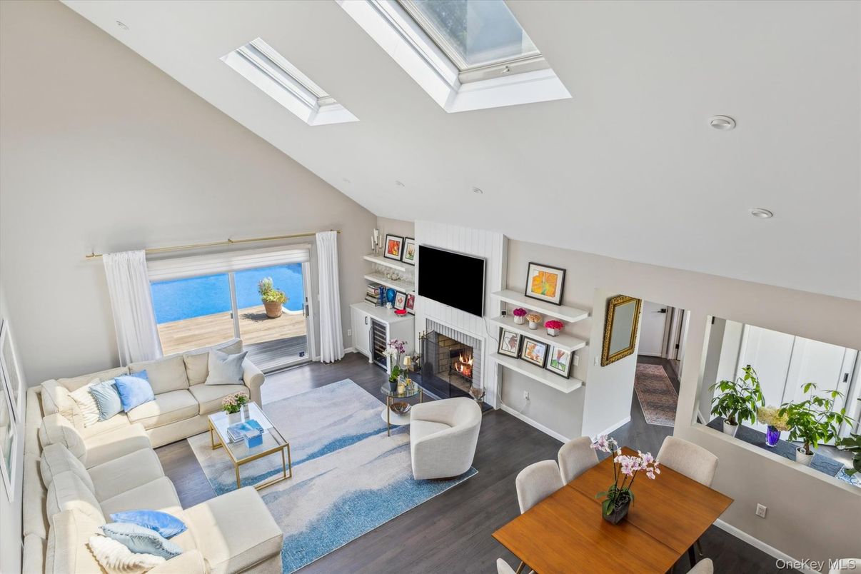 Fireplace, Interior, Living room, Recessed Lighting, Water, Wood Texture Flooring