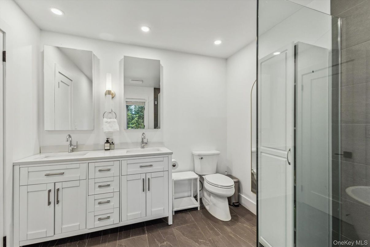 Bathroom, Dual Sink Vanities, Glass Shower, Interior, Recessed Lighting, Wood Texture Flooring