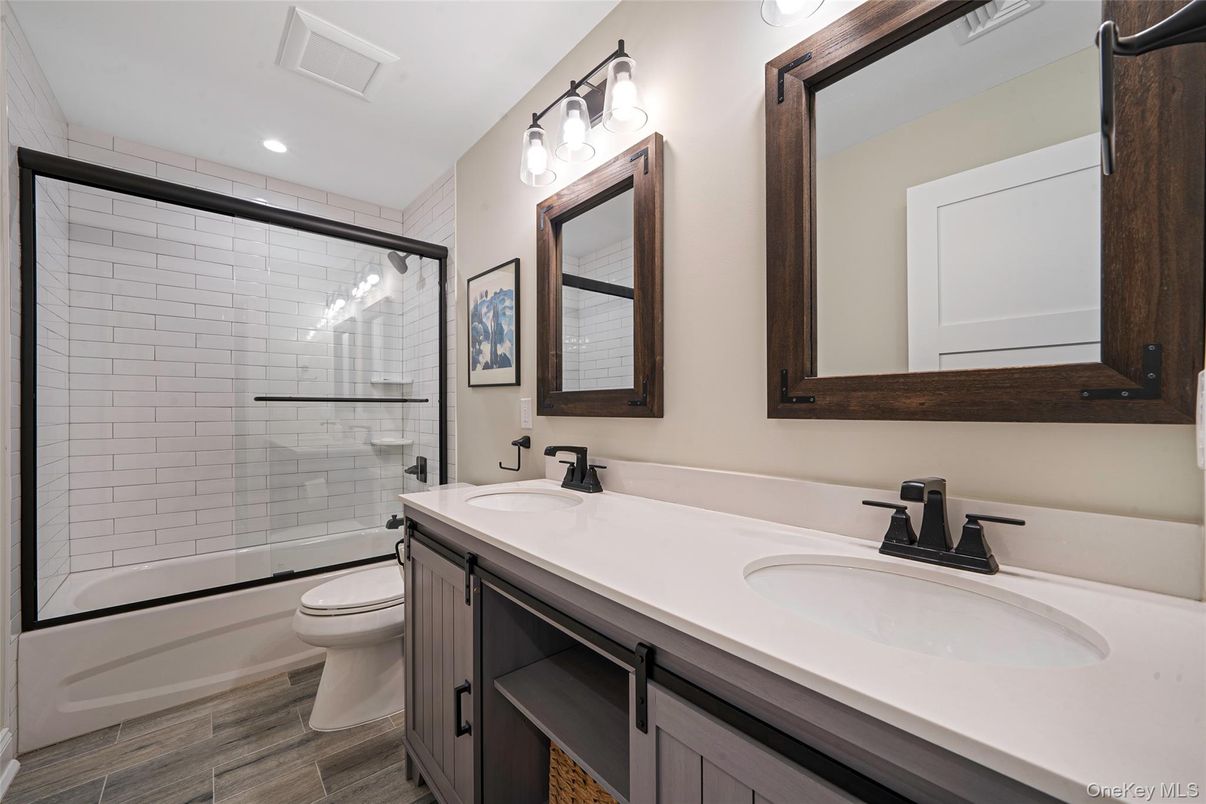 Bathroom, Dual Sink Vanities, Glass Shower, Interior, Recessed Lighting, Wood Texture Flooring