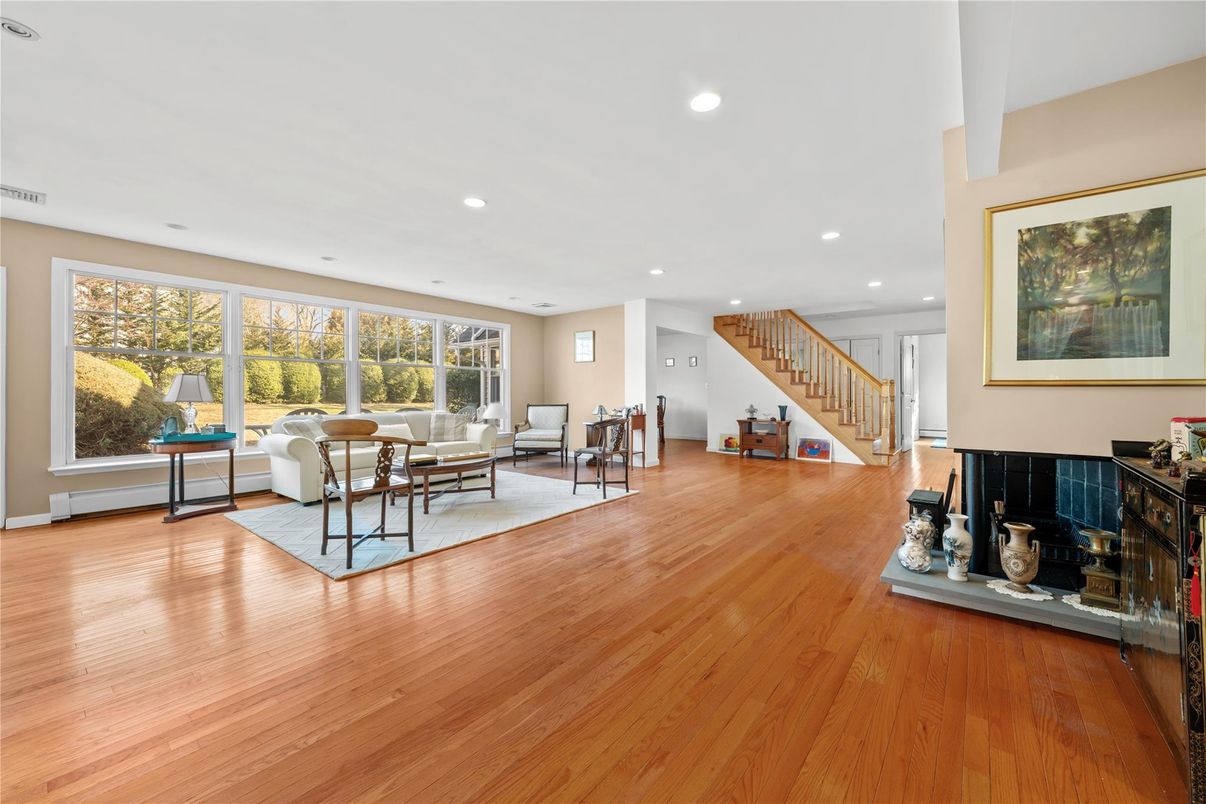 Dining room, Fireplace, Interior, Living room, Recessed Lighting, Wood Texture Flooring