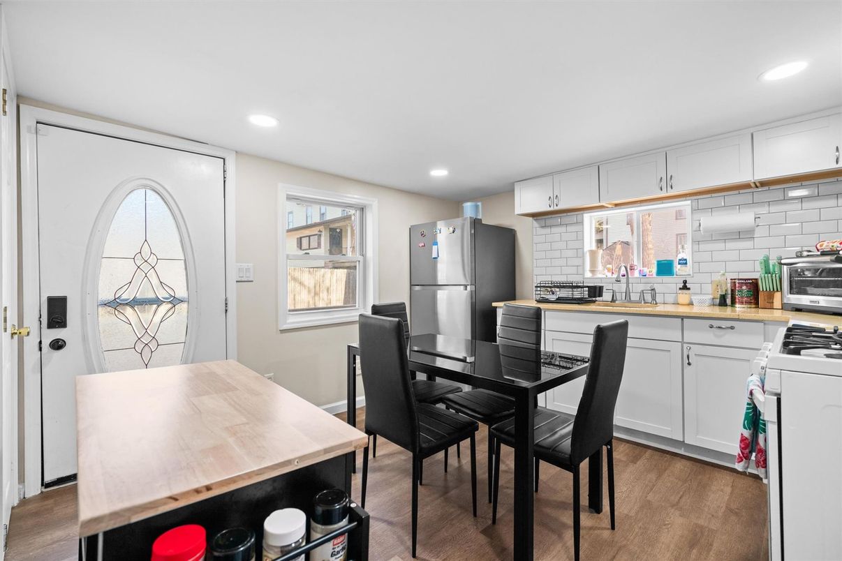 Dining room, Interior, Kitchen, Recessed Lighting, Stainless Steel Appliances, Wood Texture Flooring