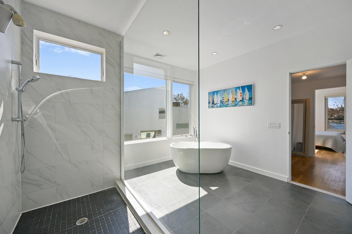 Bathroom, Free Standing Baths, Glass Shower, Interior, Marble Walls, Recessed Lighting, Wood Texture Flooring