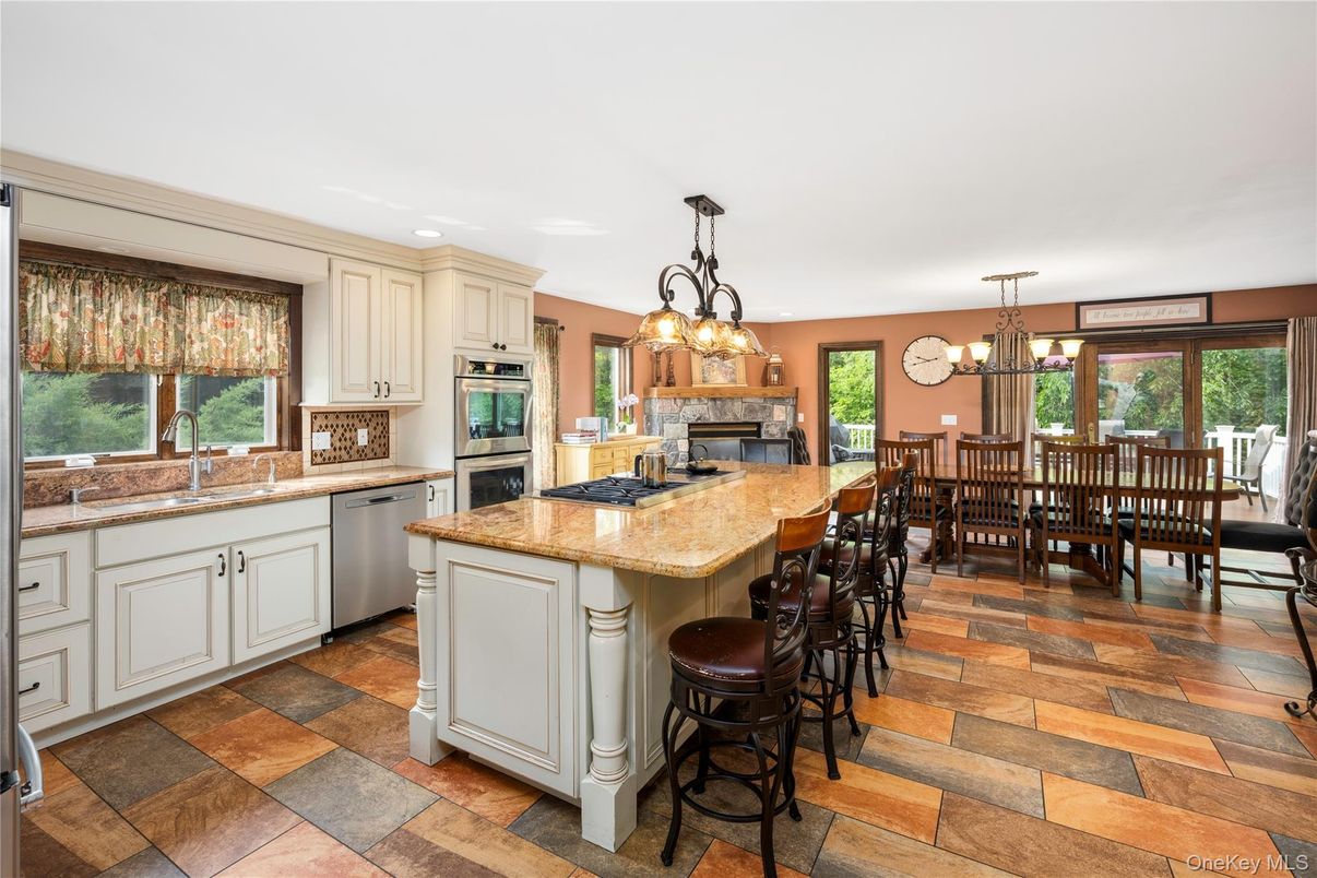 Chandelier, Dining room, Fireplace, Interior, Kitchen, Recessed Lighting, Stainless Steel Appliances