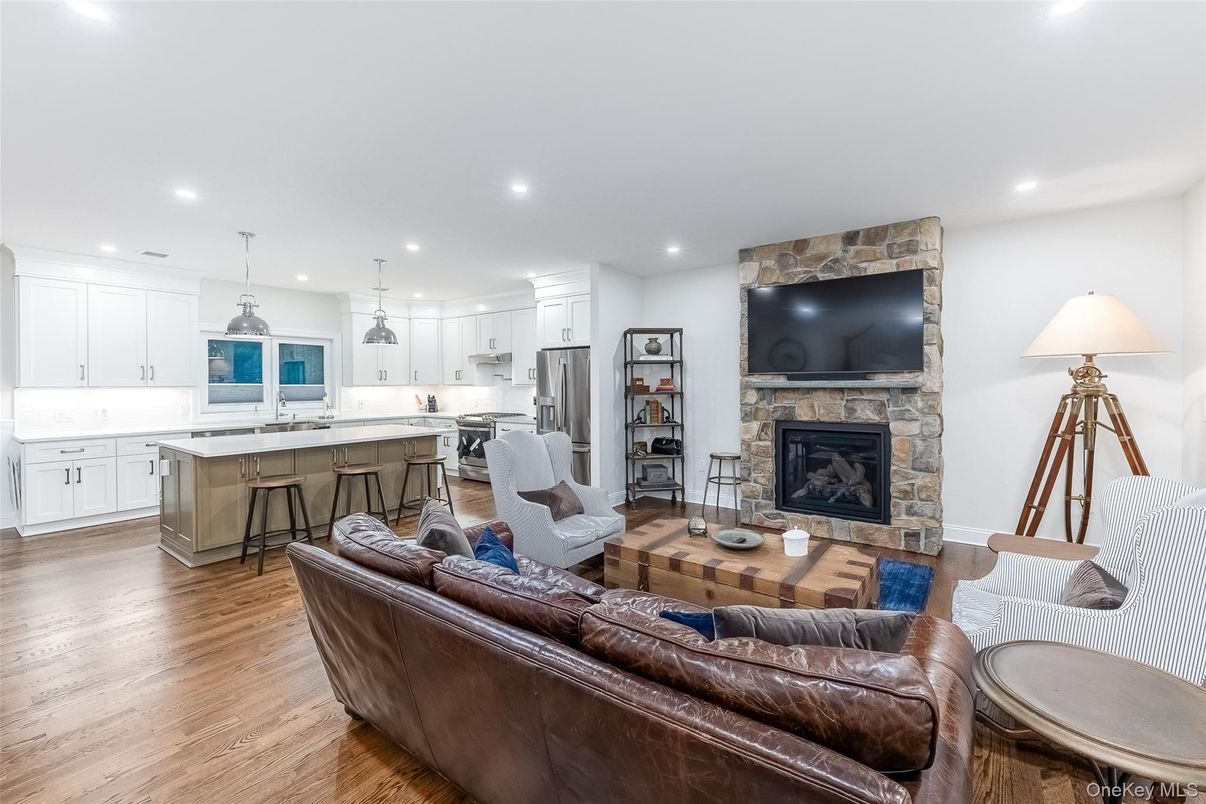 Fireplace, Interior, Kitchen, Living room, Pendant Lights, Recessed Lighting, Stainless Steel Appliances, Wood Texture Flooring