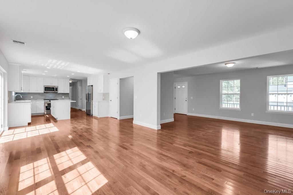 Empty room, Interior, Kitchen, Stainless Steel Appliances, Wood Texture Flooring